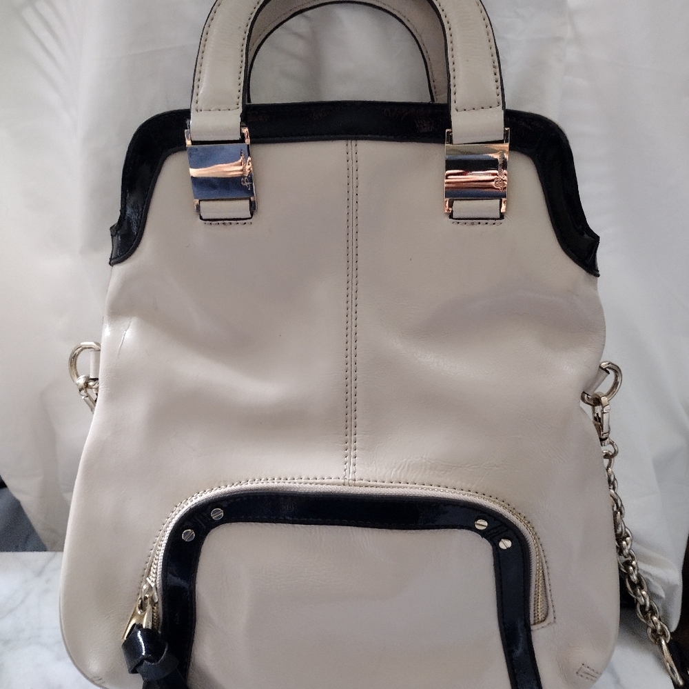 B. Makowsky White And Black leather bag